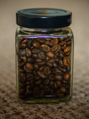 Fresh roast beans of coffee in a jar on a nice texture background