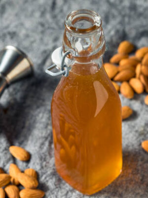 Homemade organic almond orgeat syrup in a bottle